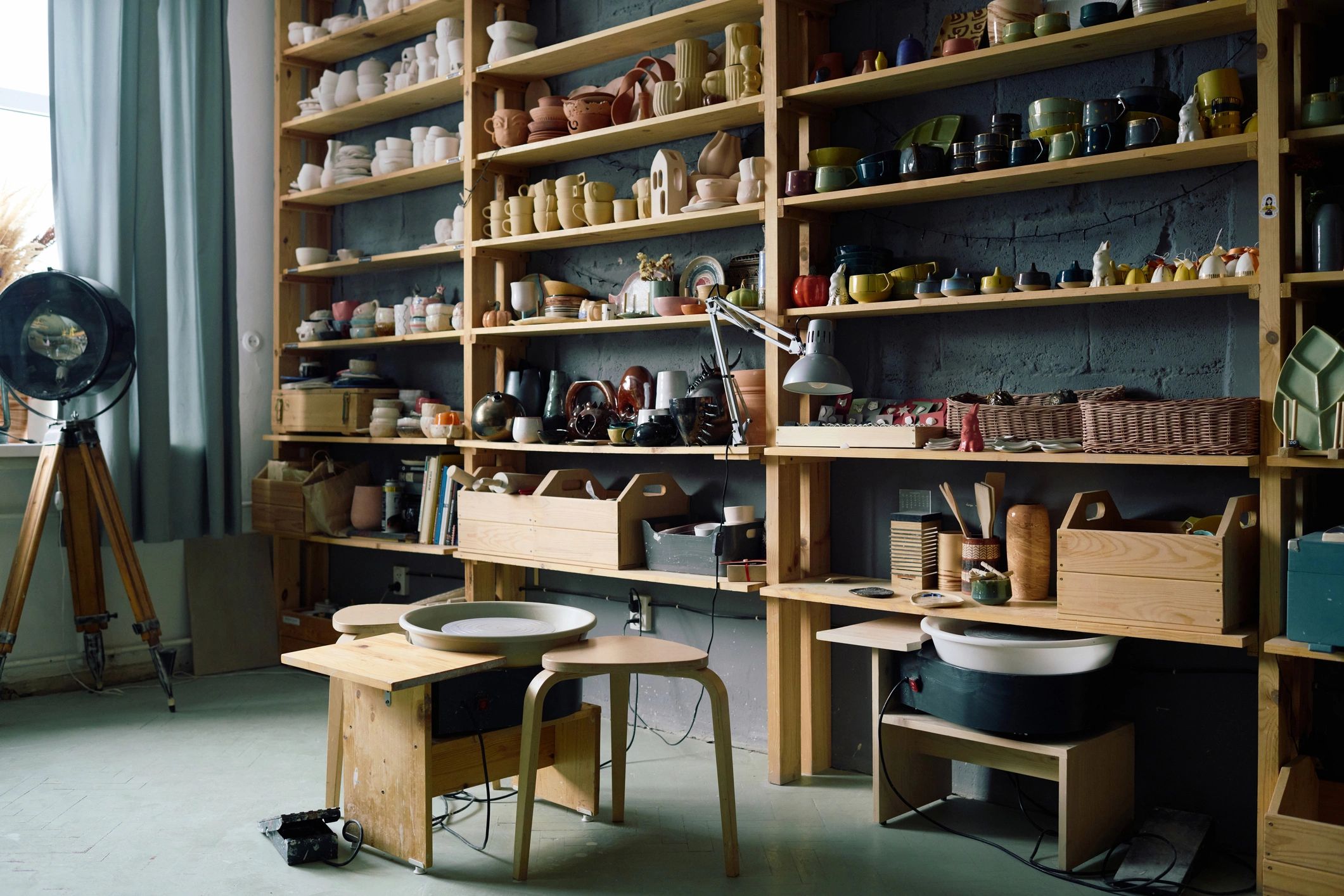 Pottery workshop interior with shelves of earthenware