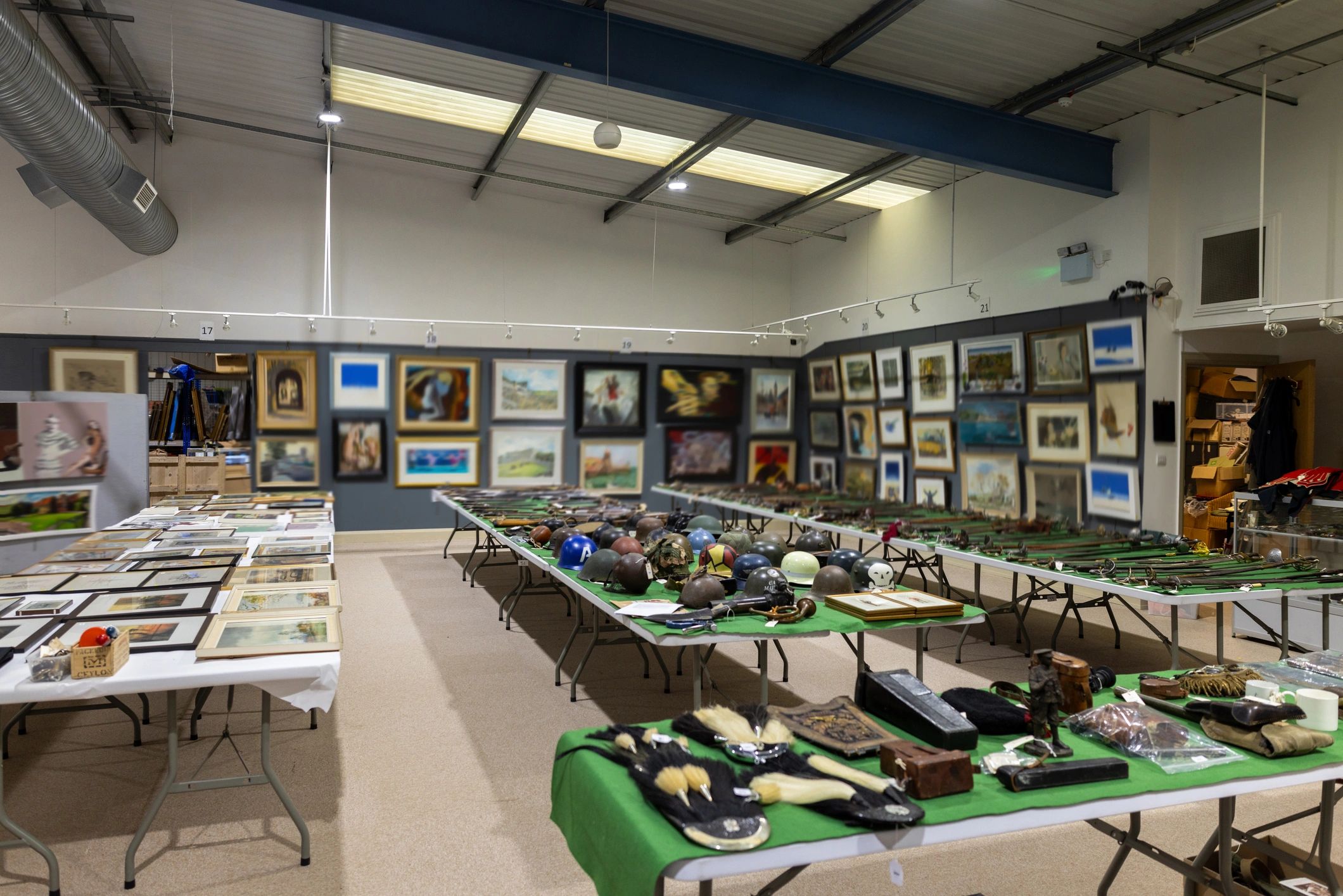 Gallery room with paintings and collected objects