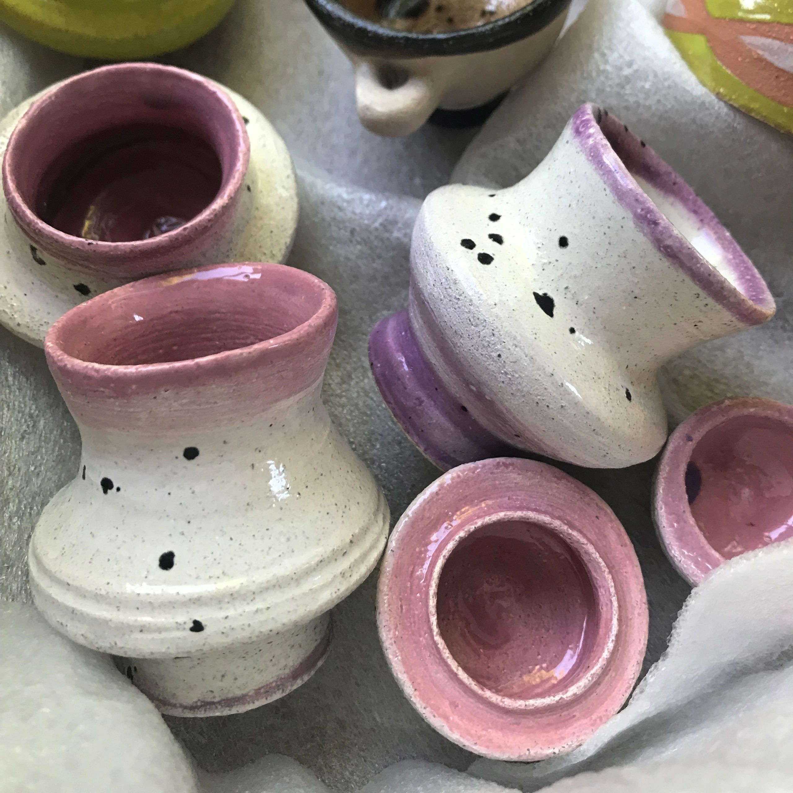 Handmade ceramic cups with vibrant colors